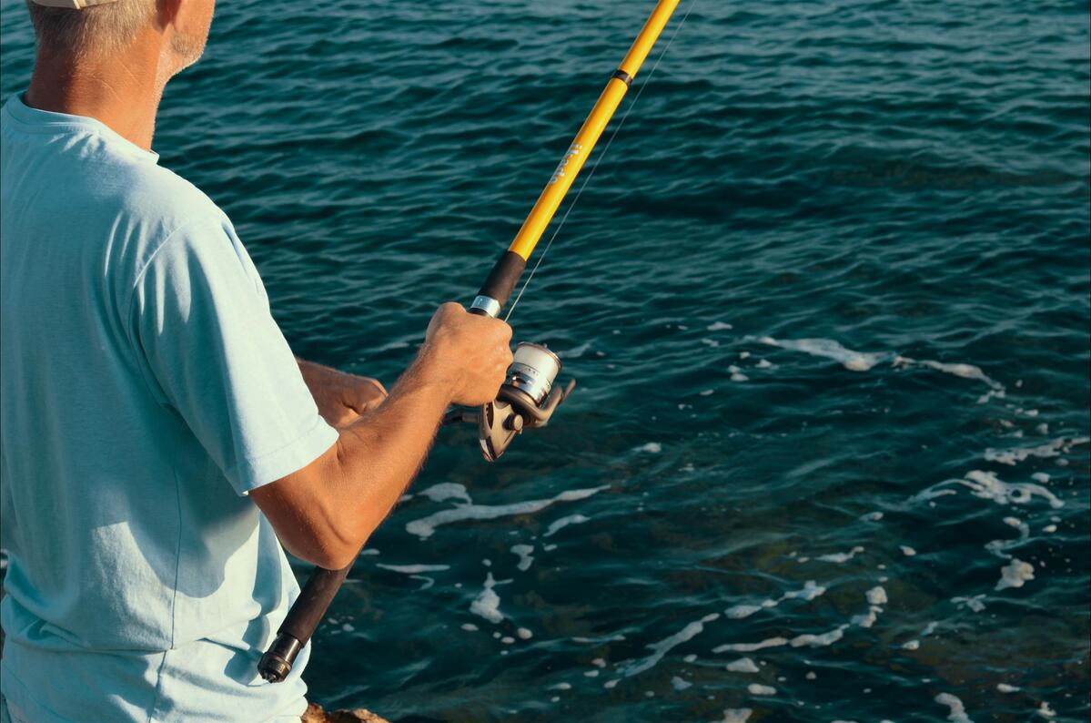 man-holding-fishing-rod.jpg